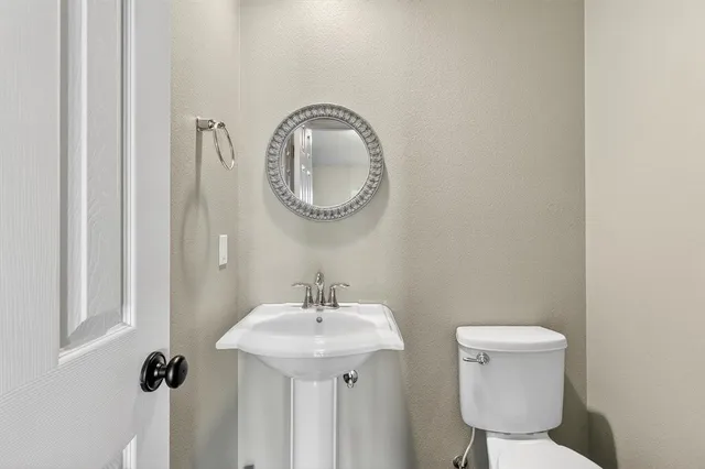 a bathroom with a toilet and a sink