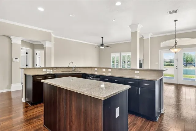 a kitchen with a sink and stove