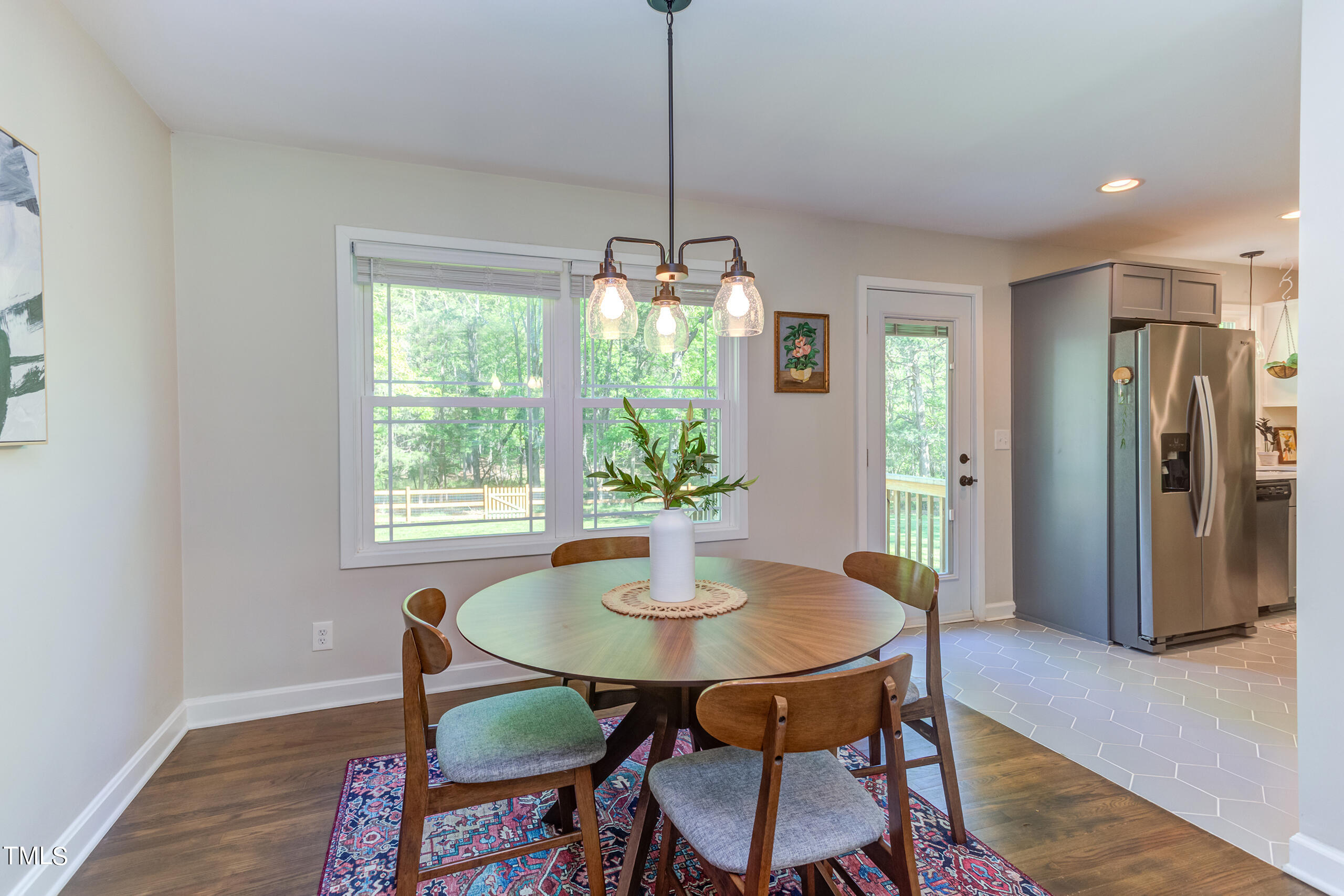 142 Chateau Road Durham, NC 27704 - Photo 12 of 45 a dining room with furniture window and wooden floor