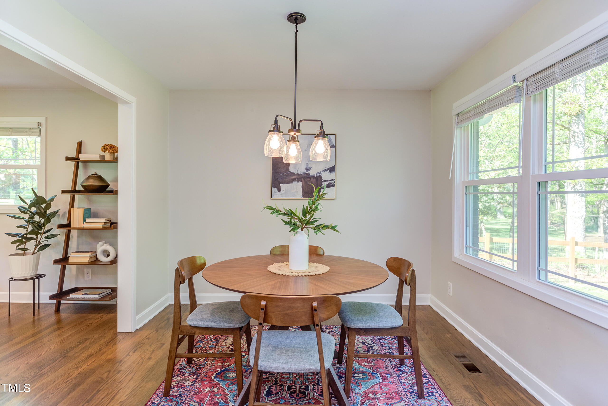 142 Chateau Road Durham, NC 27704 - Photo 13 of 45 a dining room with furniture and wooden floor
