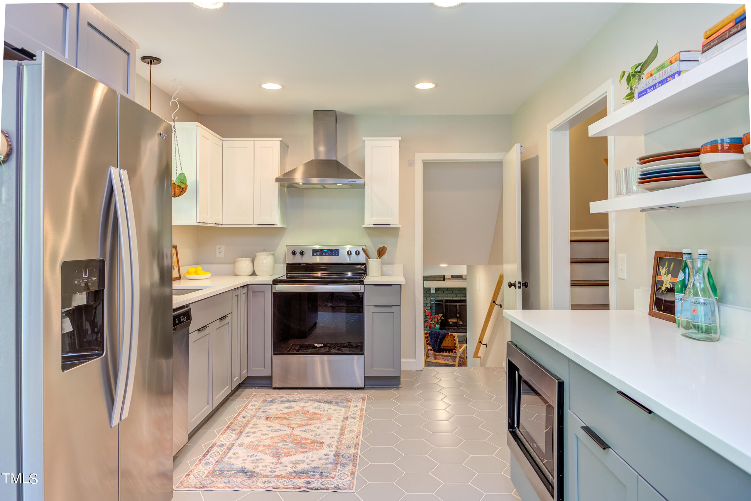 142 Chateau Road Durham, NC 27704 - Photo 15 of 45 a kitchen with stainless steel appliances a refrigerator sink and stove