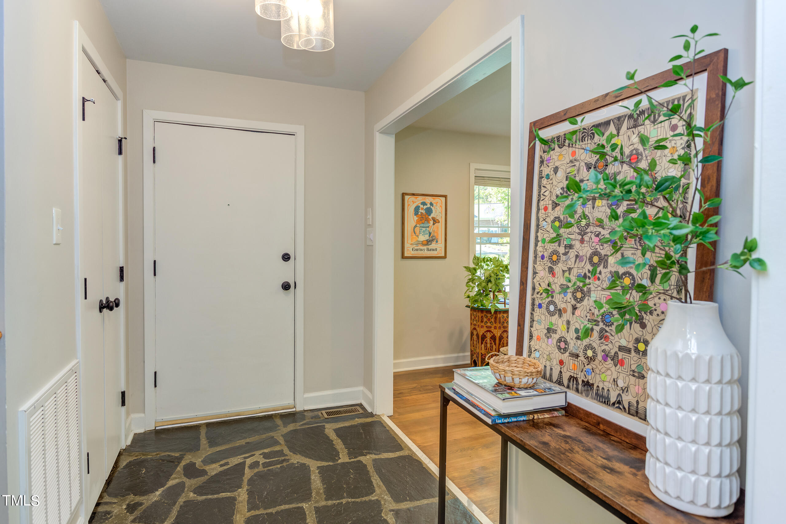 142 Chateau Road Durham, NC 27704 - Photo 20 of 45 a room with painting and a potted plant