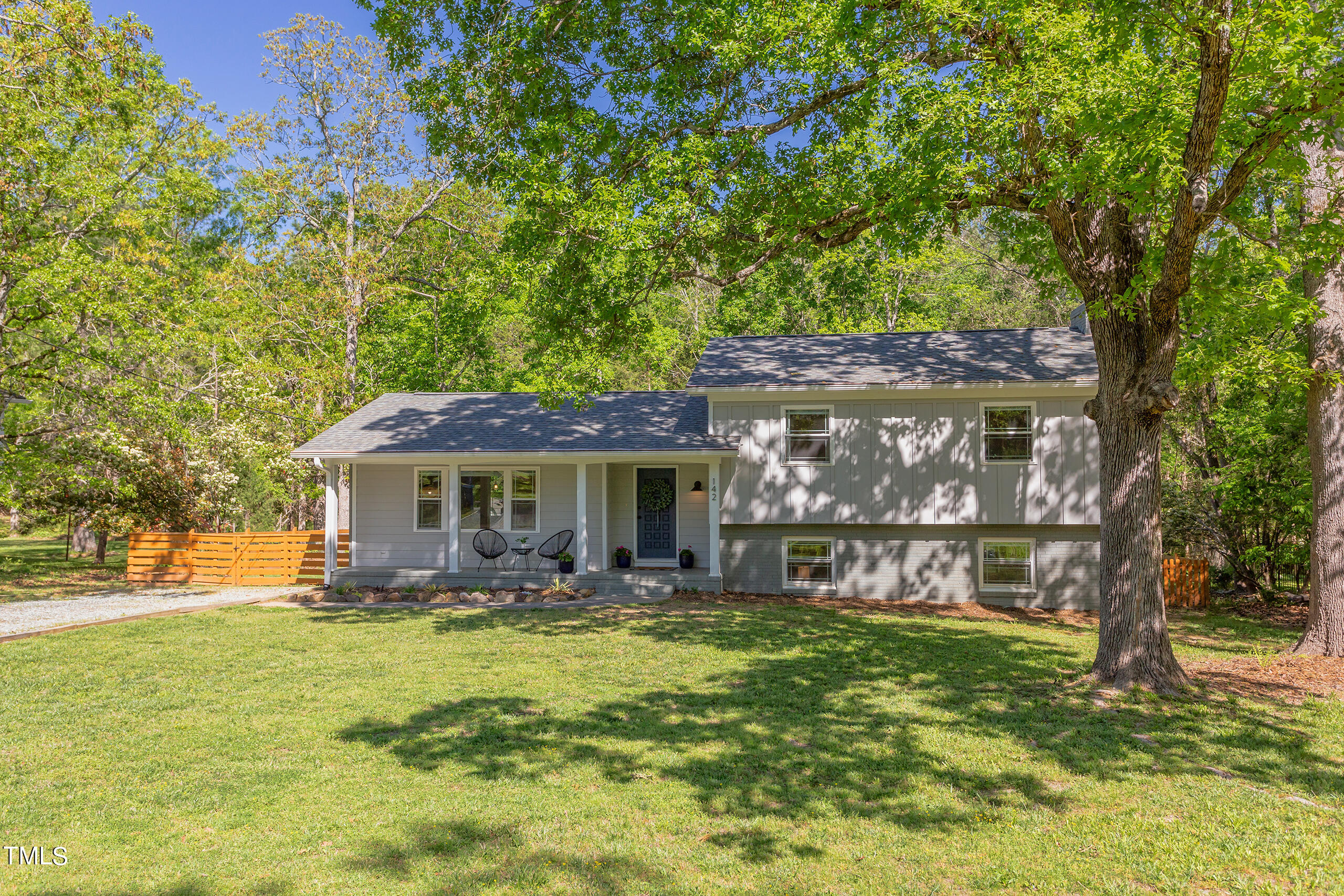 142 Chateau Road Durham, NC 27704 - Photo 2 of 45 a view of a house with a yard