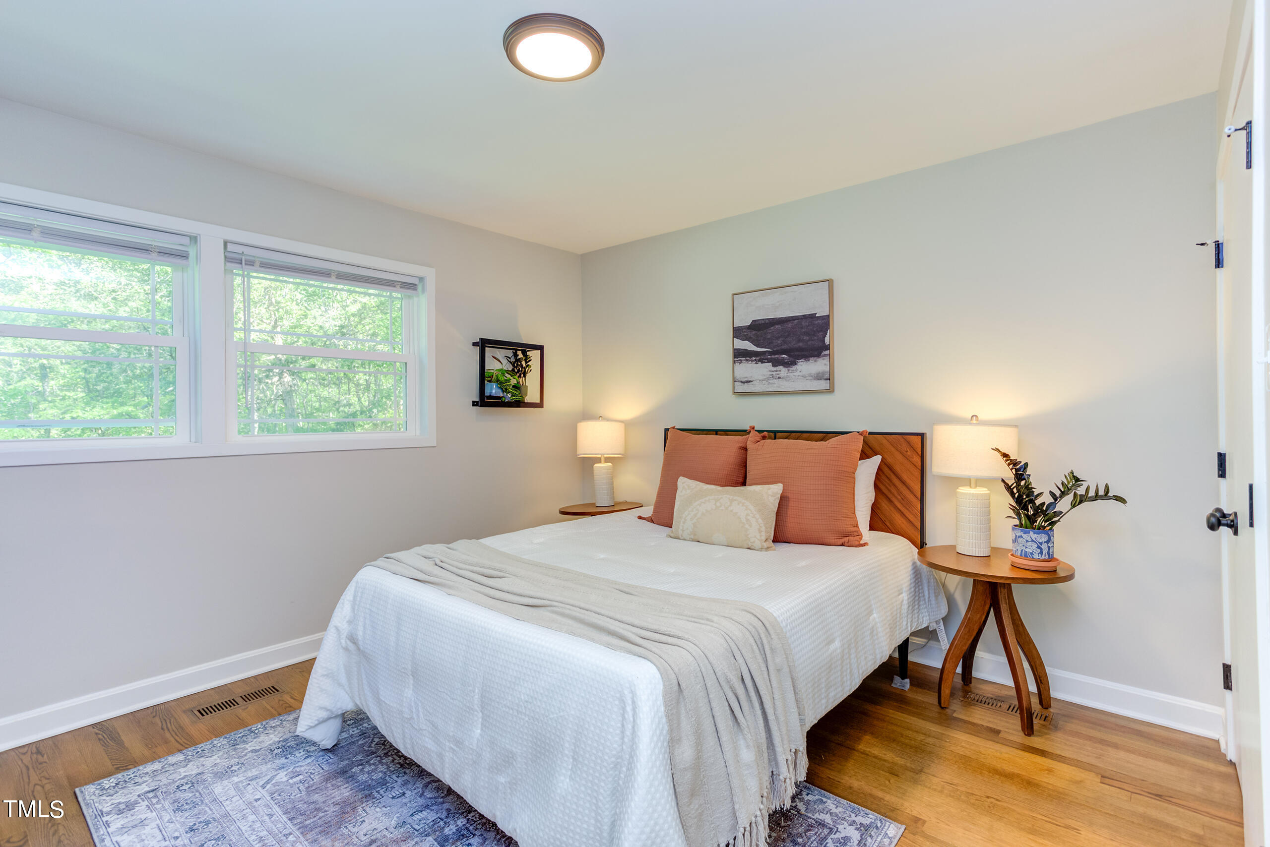 142 Chateau Road Durham, NC 27704 - Photo 21 of 45 a bedroom with a bed and a window