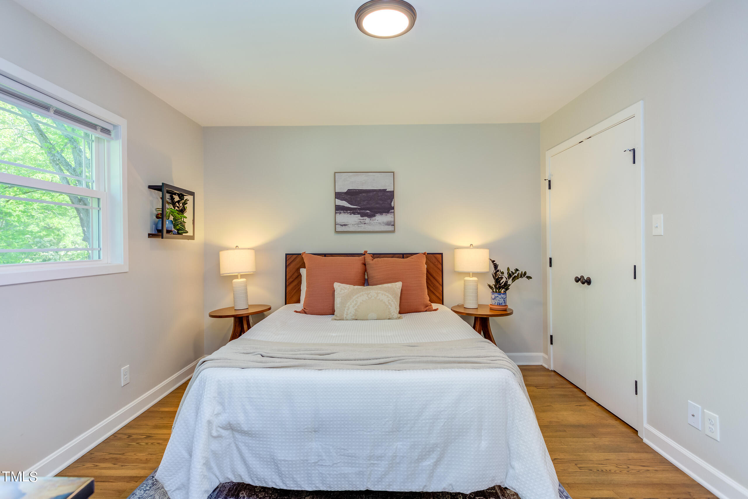 142 Chateau Road Durham, NC 27704 - Photo 22 of 45 a bedroom with a bed and a window