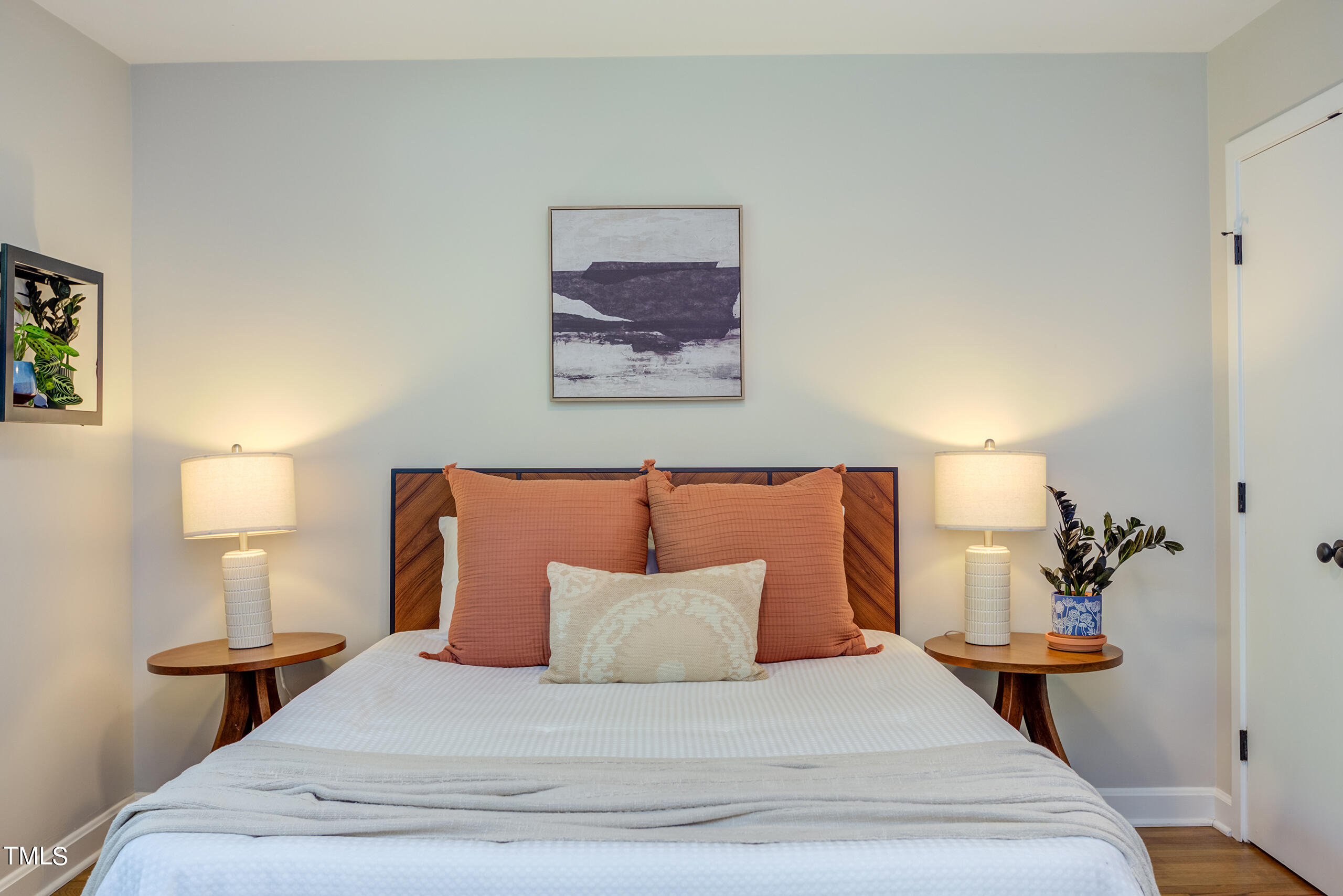 142 Chateau Road Durham, NC 27704 - Photo 23 of 45 a bedroom with a bed and a lamp