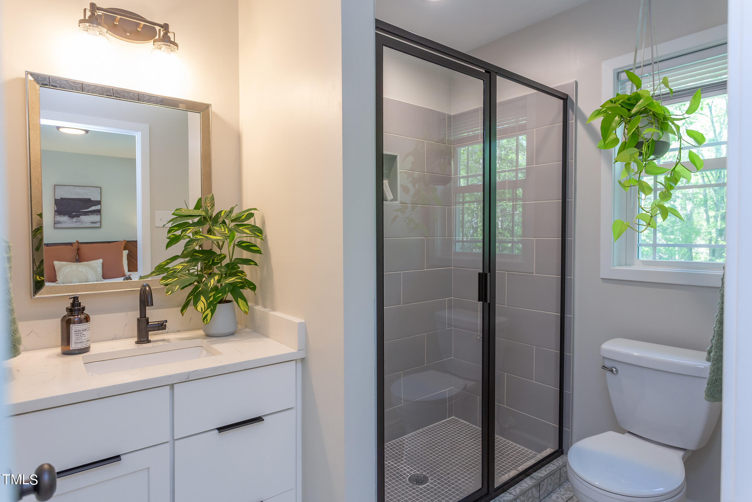 142 Chateau Road Durham, NC 27704 - Photo 24 of 45 a bathroom with a sink toilet and shower