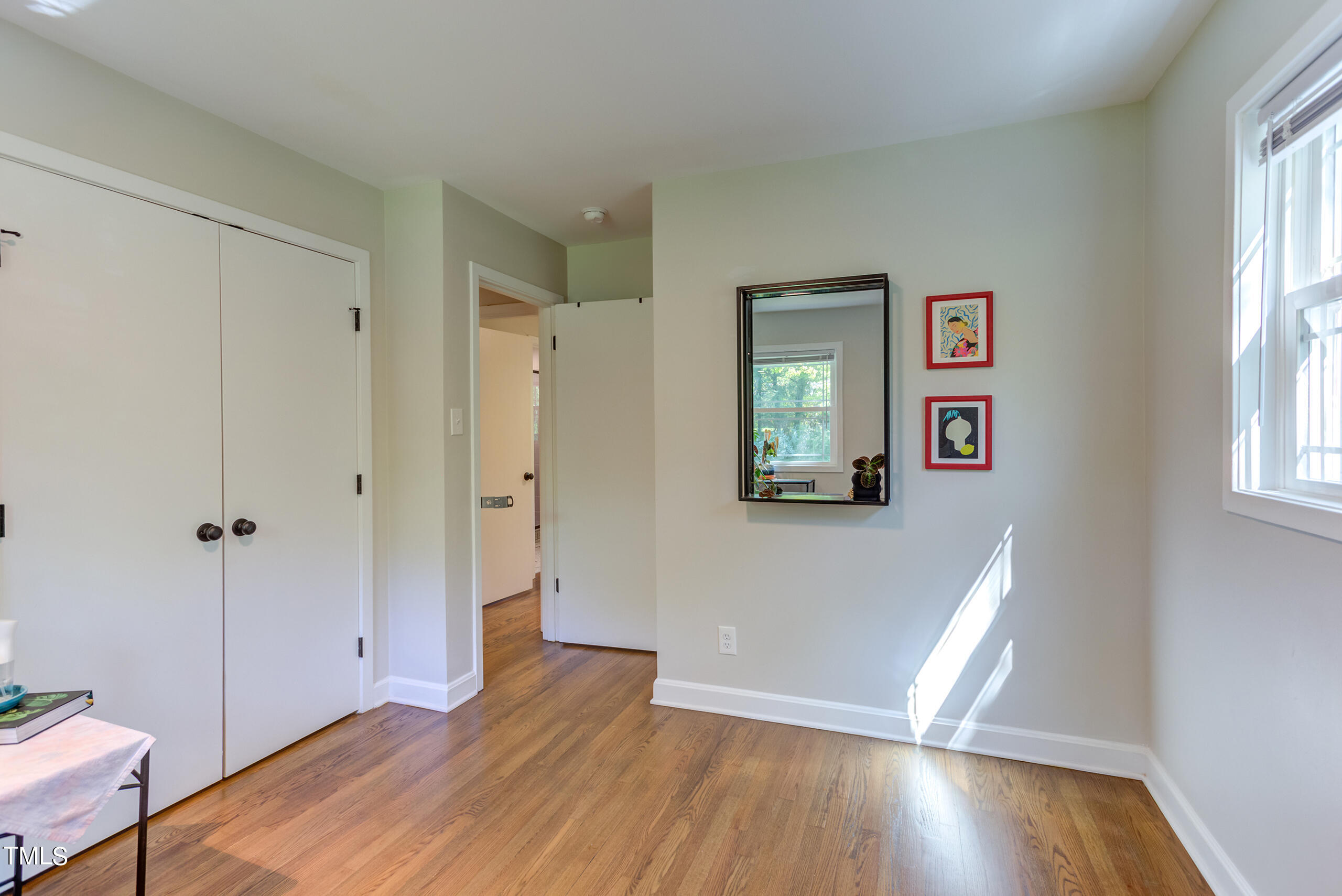 142 Chateau Road Durham, NC 27704 - Photo 31 of 45 a view of a room with wooden floor and window