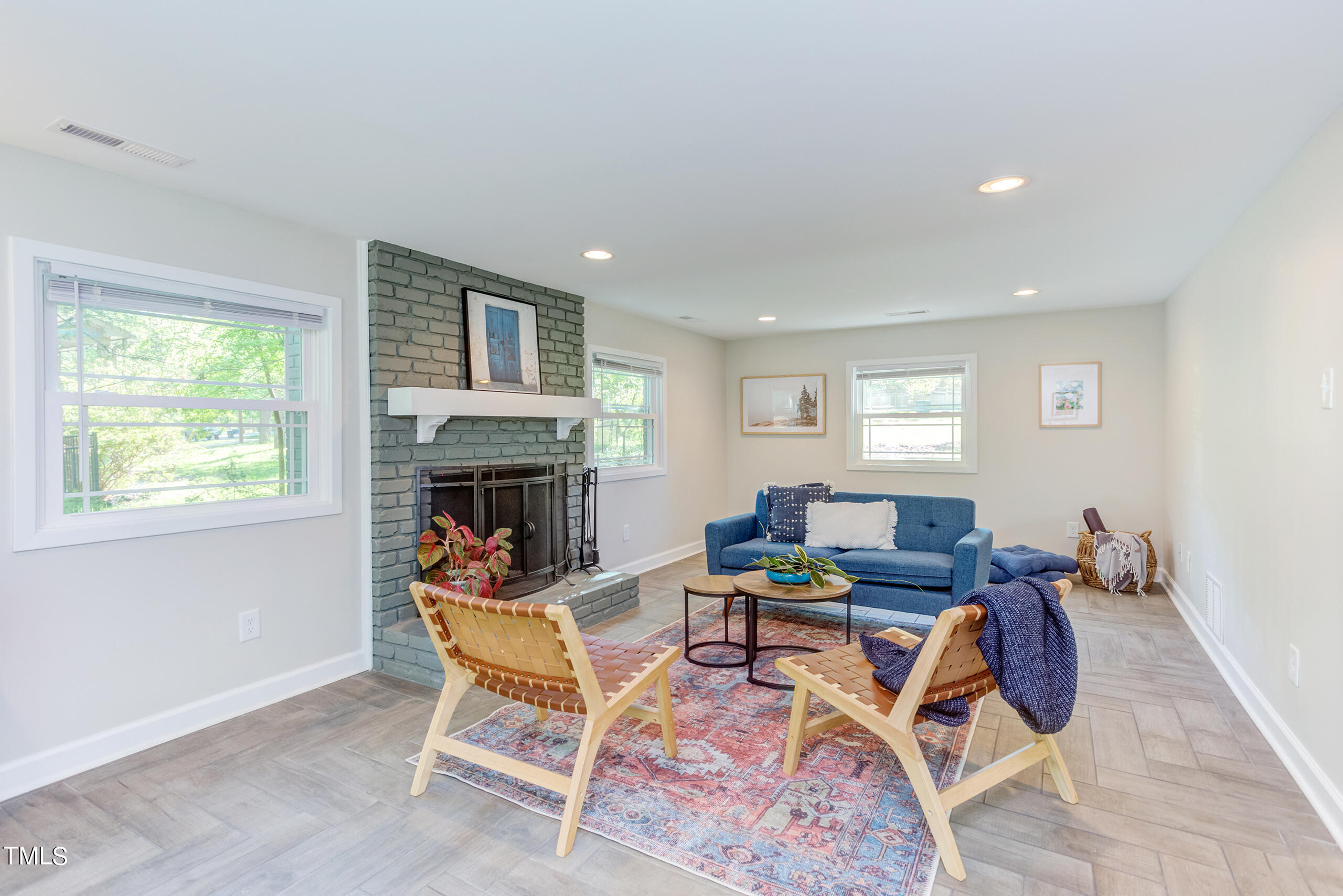 142 Chateau Road Durham, NC 27704 - Photo 33 of 45 a living room with furniture and a fireplace
