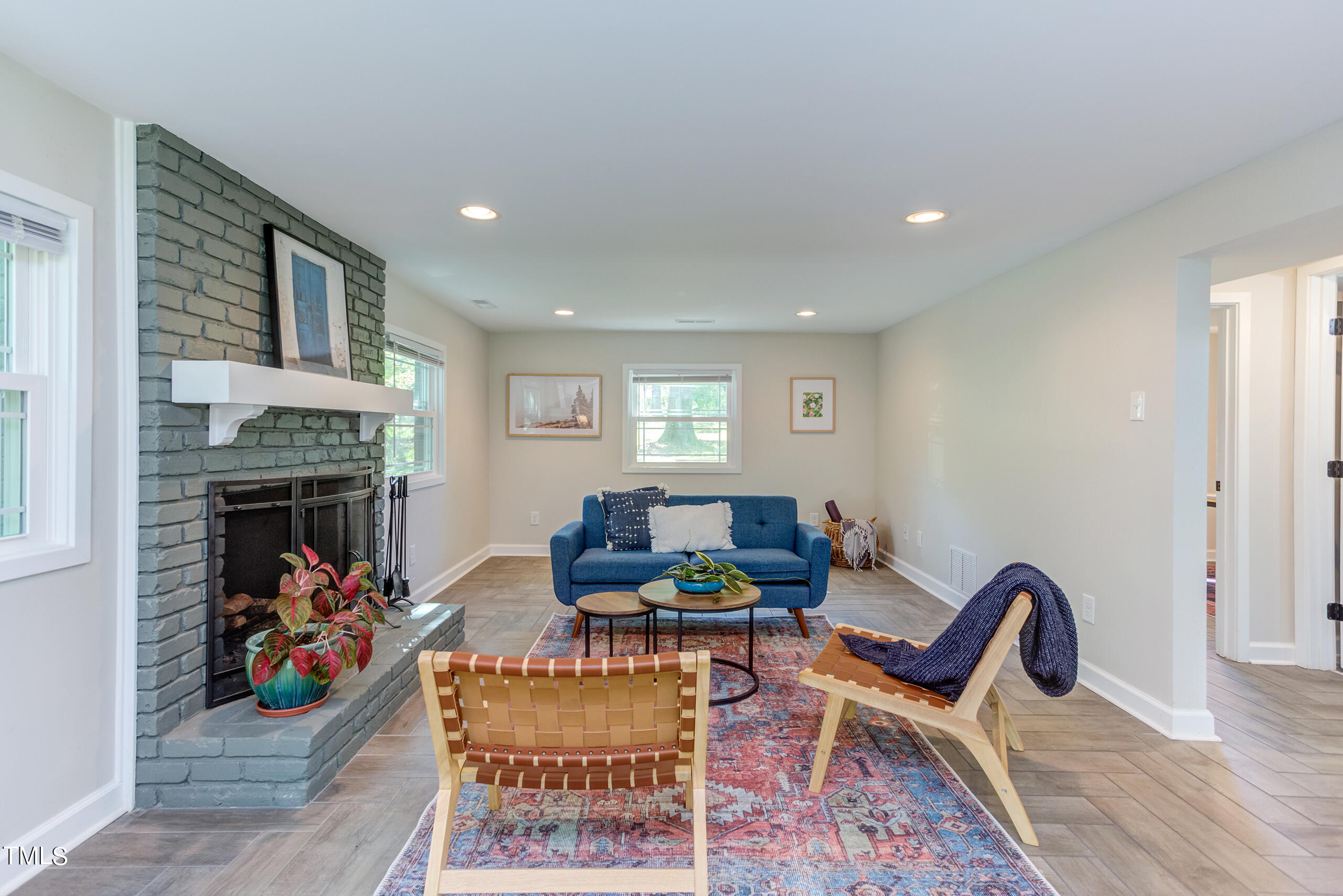 142 Chateau Road Durham, NC 27704 - Photo 34 of 45 a living room with furniture and a fireplace