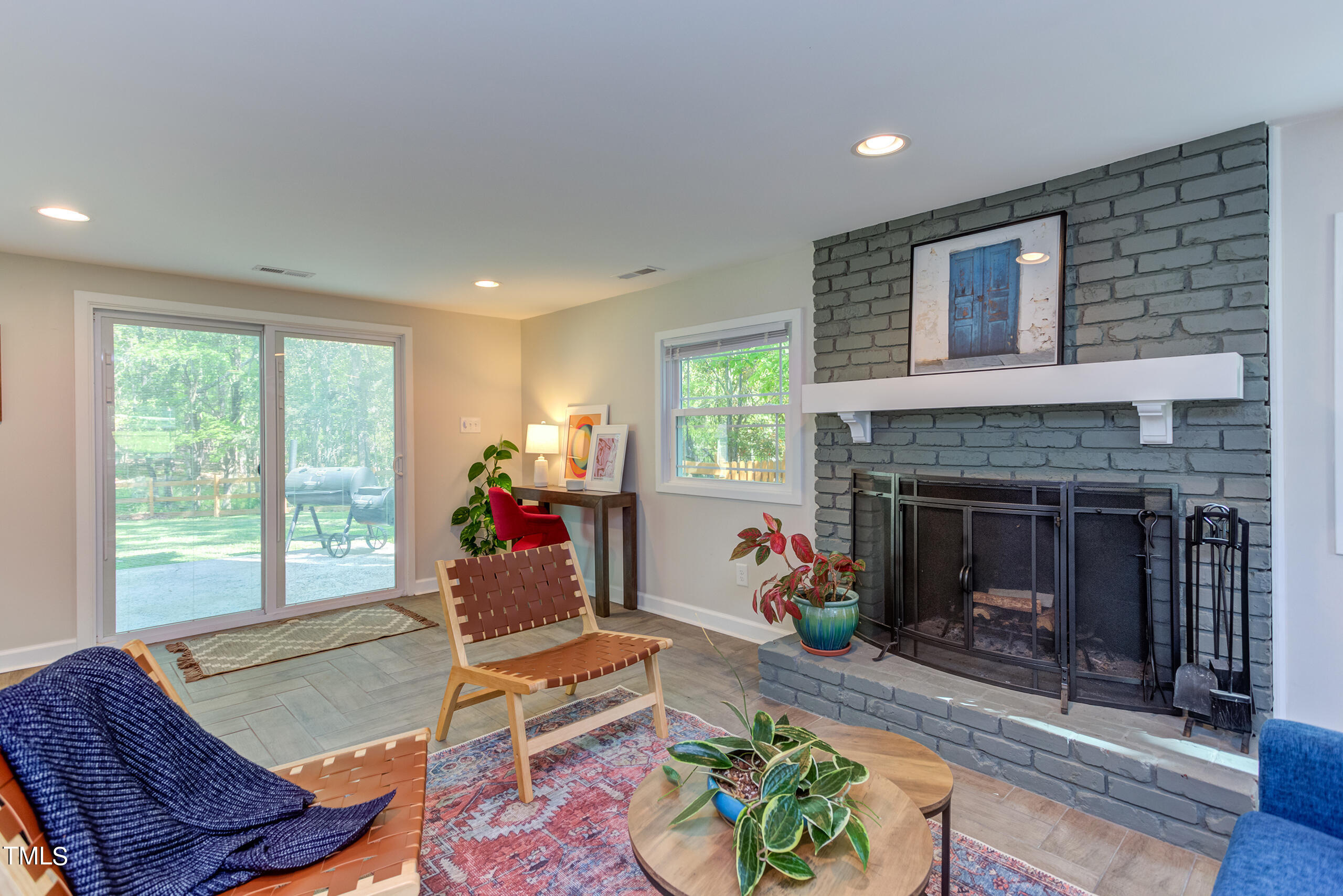 142 Chateau Road Durham, NC 27704 - Photo 35 of 45 a living room with furniture and a fireplace