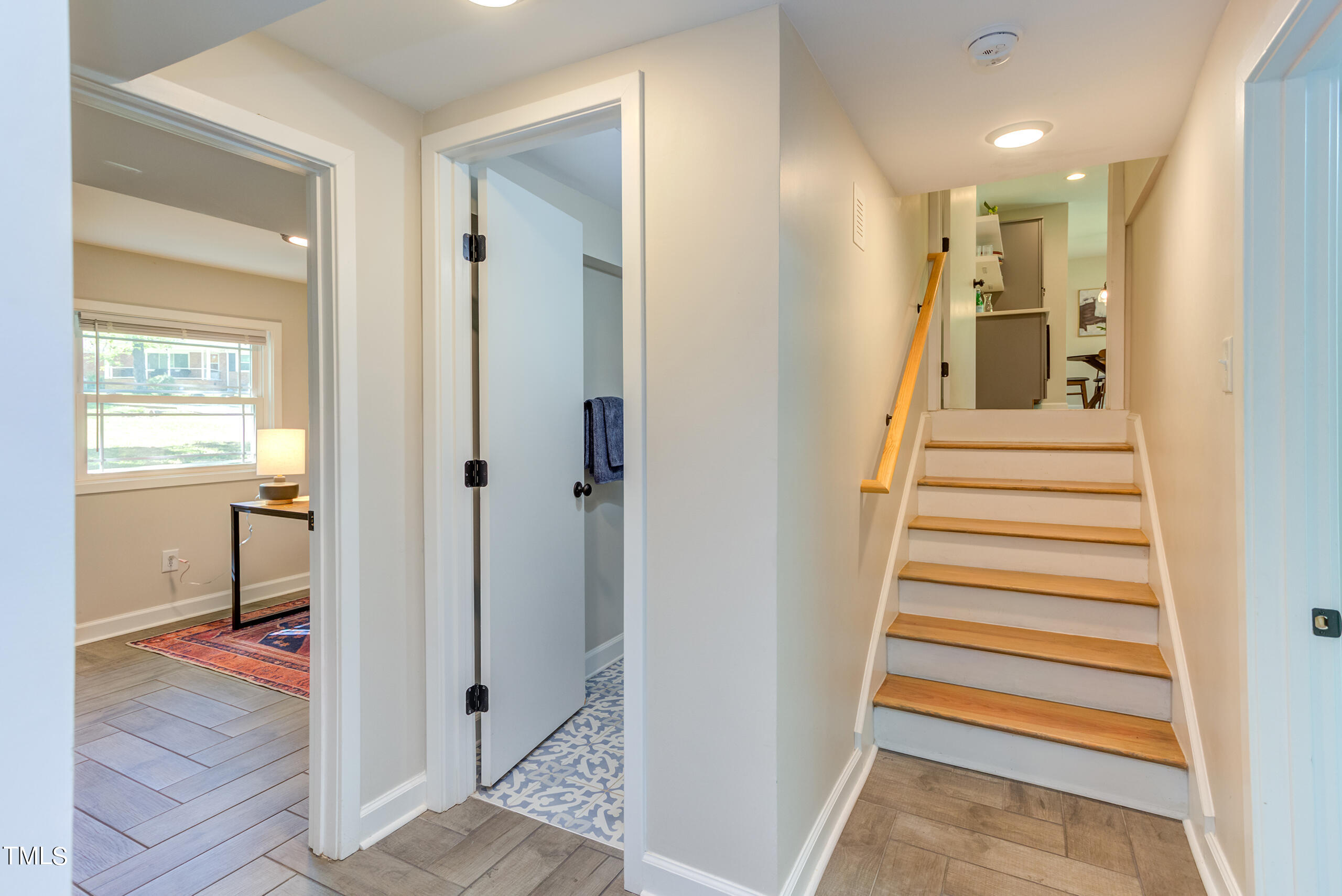 142 Chateau Road Durham, NC 27704 - Photo 37 of 45 a view of a hallway with a hallway and a livingroom with furniture