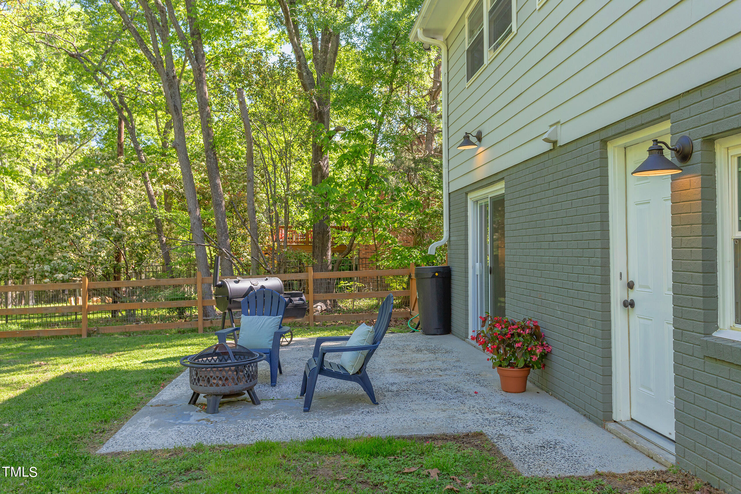 142 Chateau Road Durham, NC 27704 - Photo 42 of 45 a view of a chair and table in backyard of the house