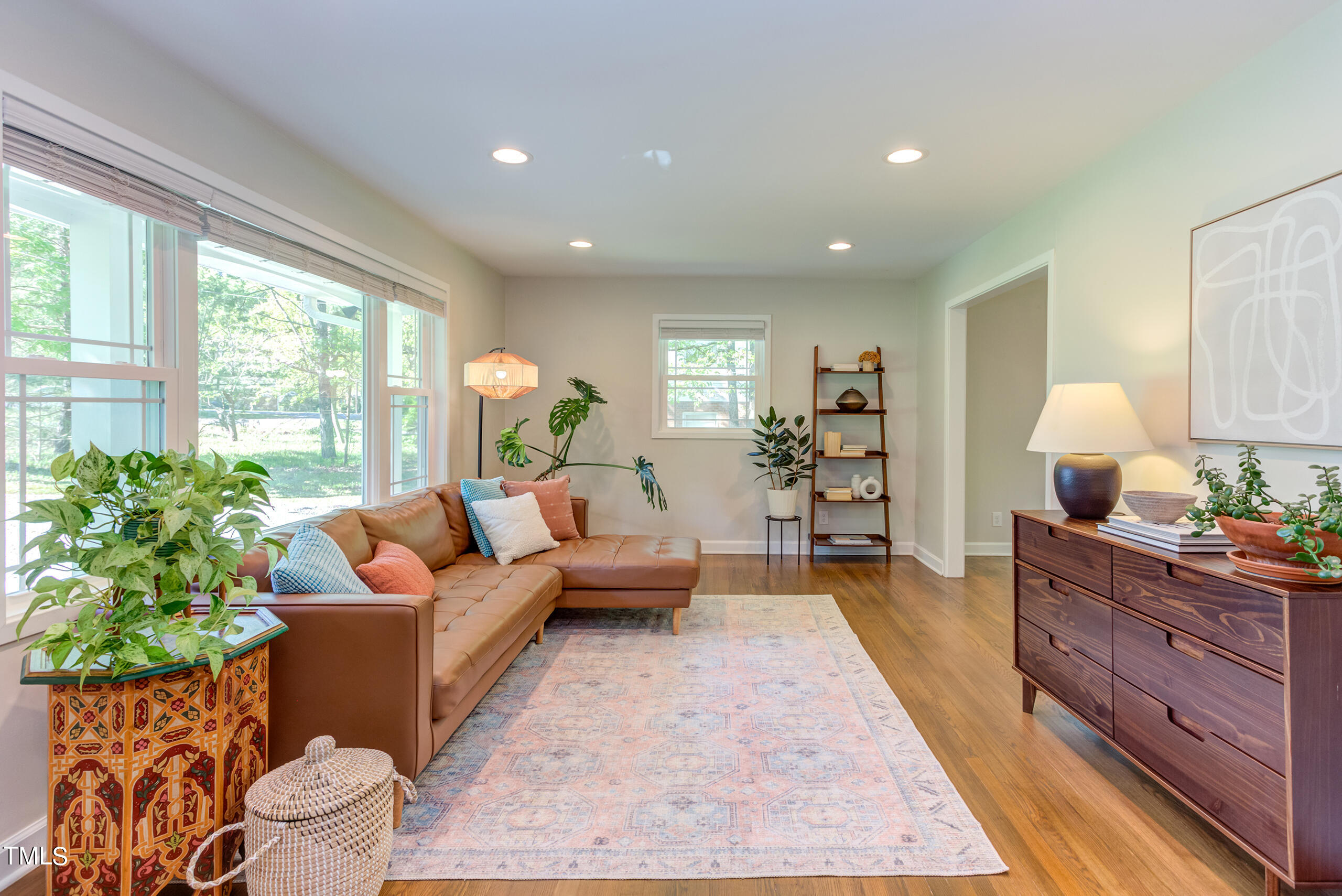 142 Chateau Road Durham, NC 27704 - Photo 6 of 45 a living room with furniture and a large window