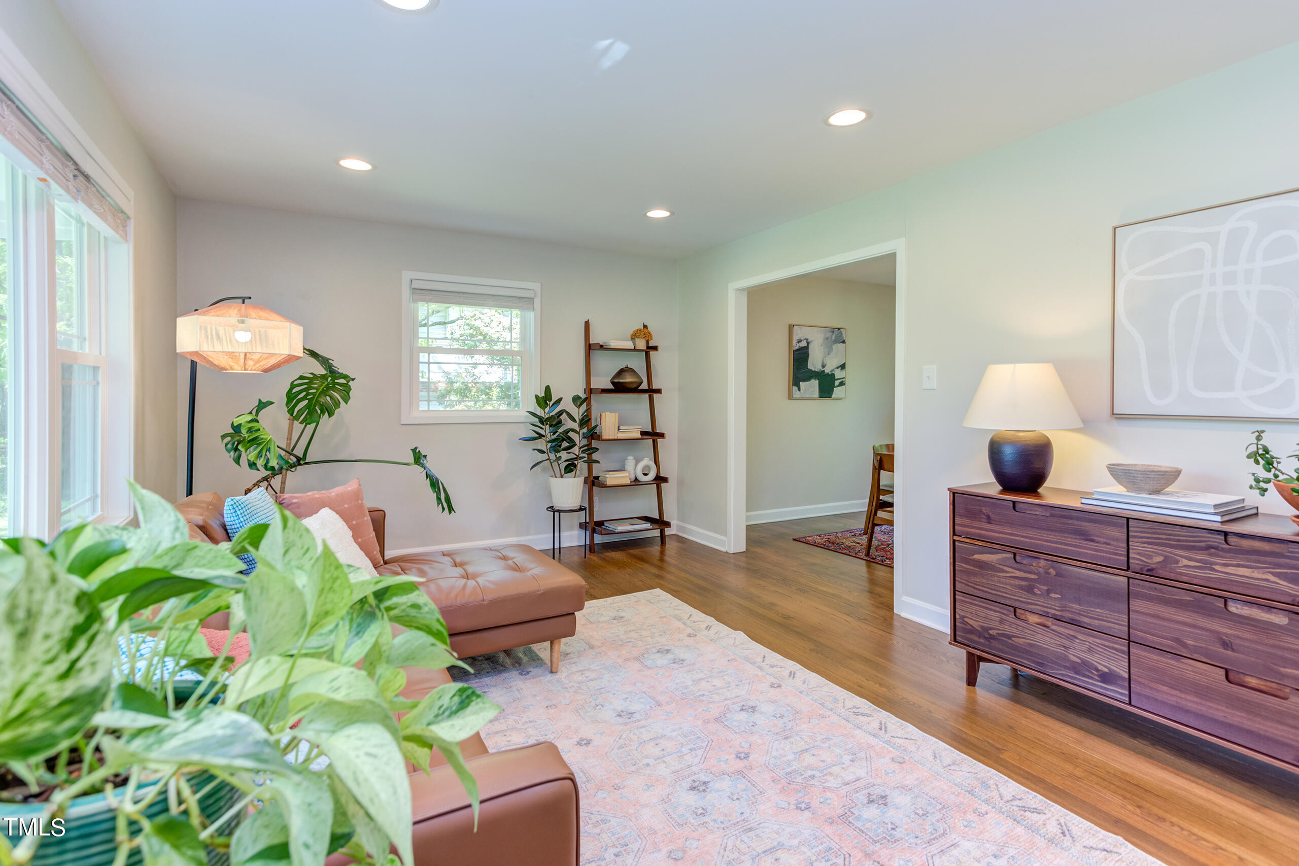 142 Chateau Road Durham, NC 27704 - Photo 7 of 45 a living room with furniture and a wooden floor