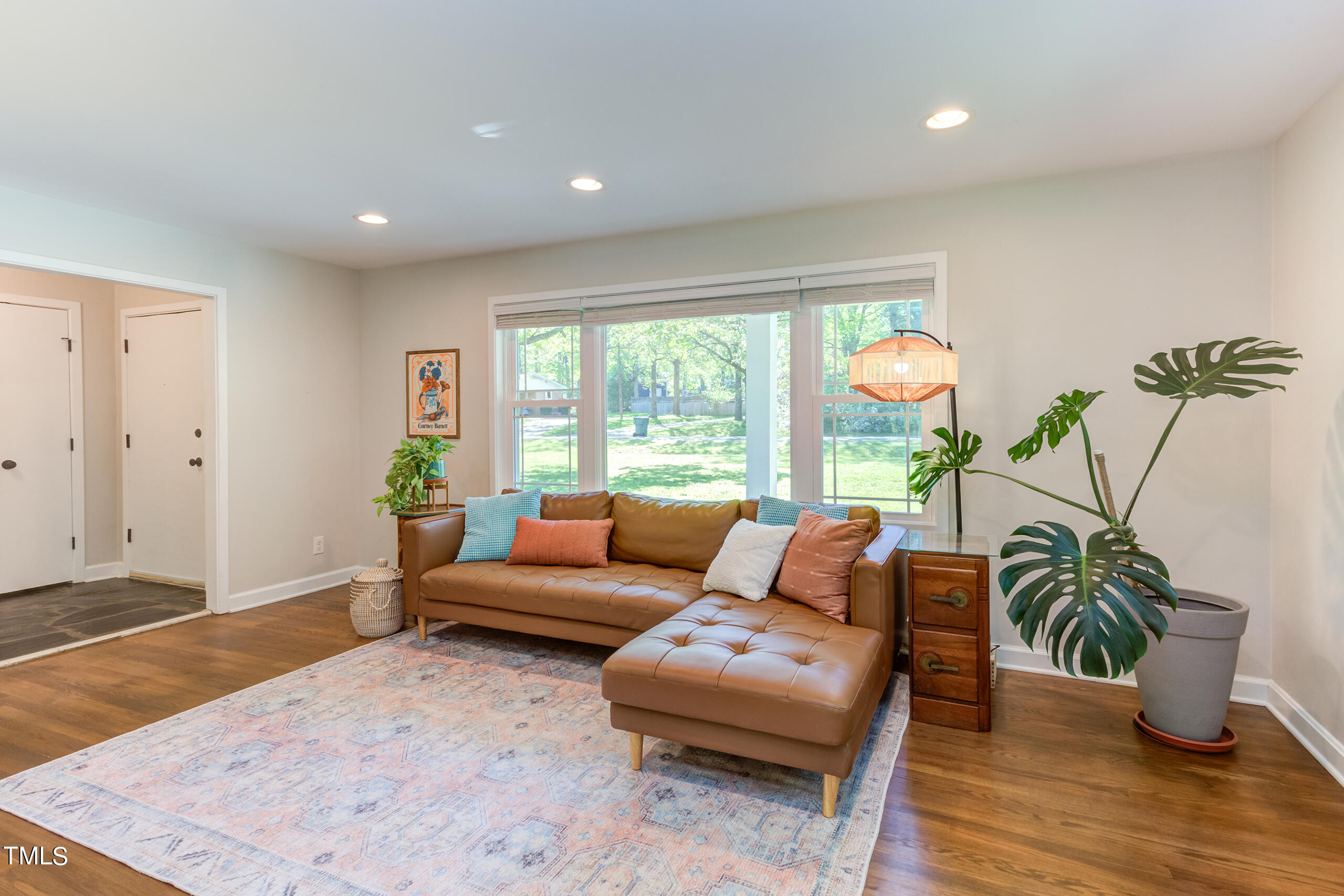 142 Chateau Road Durham, NC 27704 - Photo 8 of 45 a living room with furniture and a large window