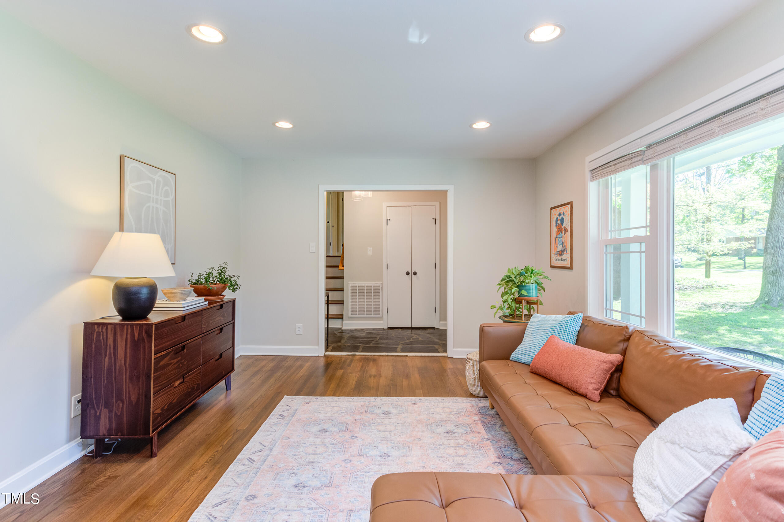 142 Chateau Road Durham, NC 27704 - Photo 9 of 45 a living room with furniture and a large window