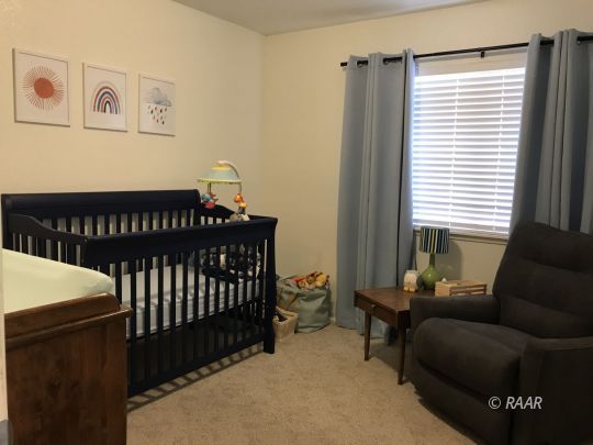 1237 West Iowa Avenue Ridgecrest, CA 93555 - Photo 11 of 20 a bedroom with furniture and a window