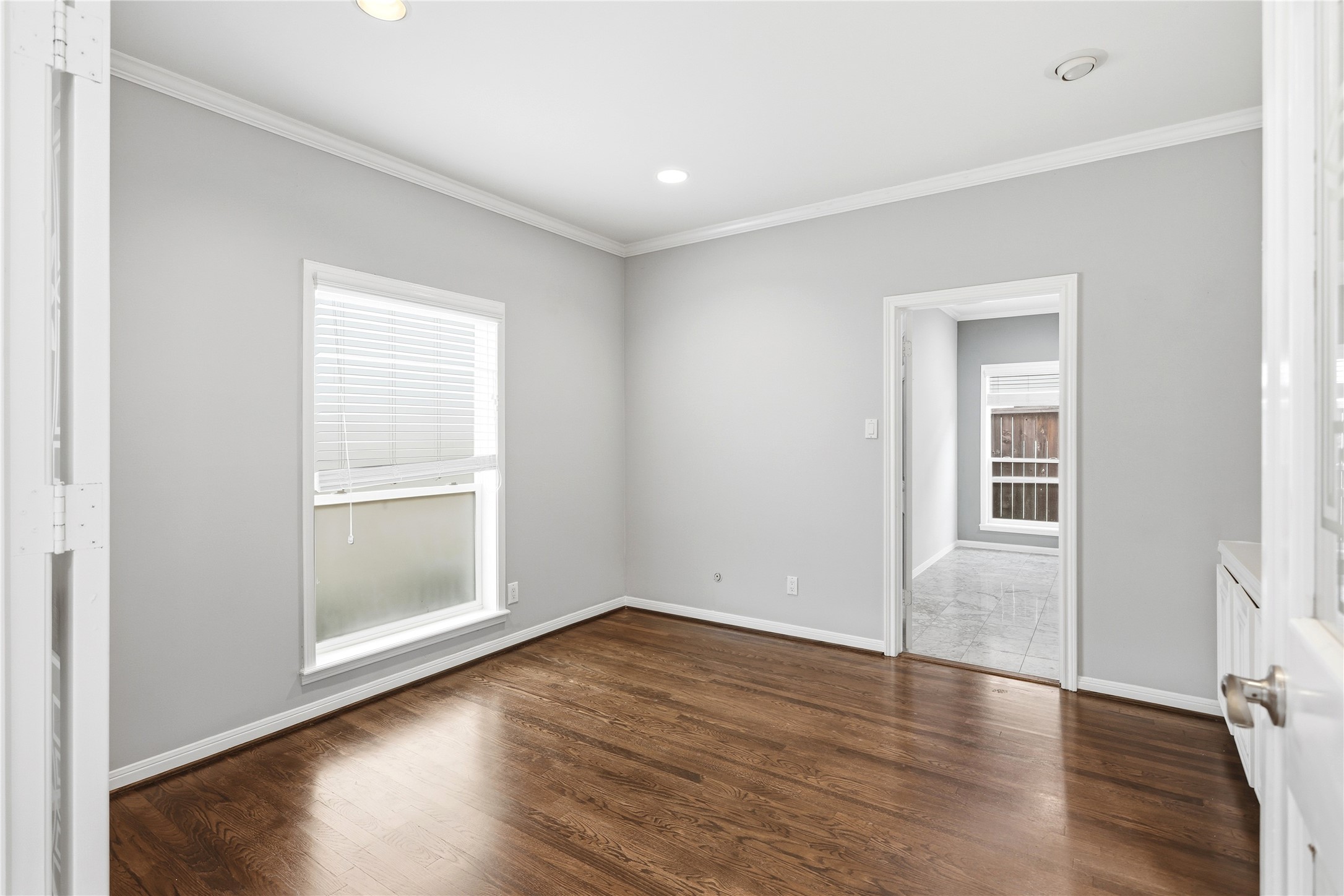 11507 Del Monte Drive Houston, TX 77077 - Photo 17 of 44 Home office/ study between foyer and primary bedroom.