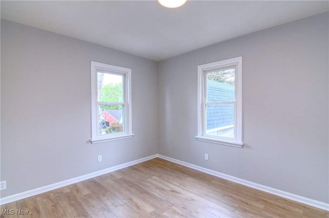 12341 Portage Street Rittman, OH 44270 - Photo 6 of 23 Spare room with a healthy amount of sunlight and light hardwood / wood-style floors