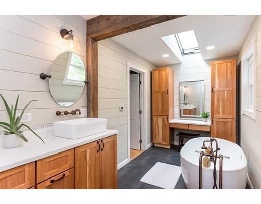 945 Townsend Road Groton, MA 01450 - Photo 8 of 30 a bathroom with a sink and a mirror