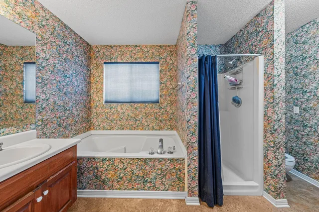 a bathroom with a bathtub and shower