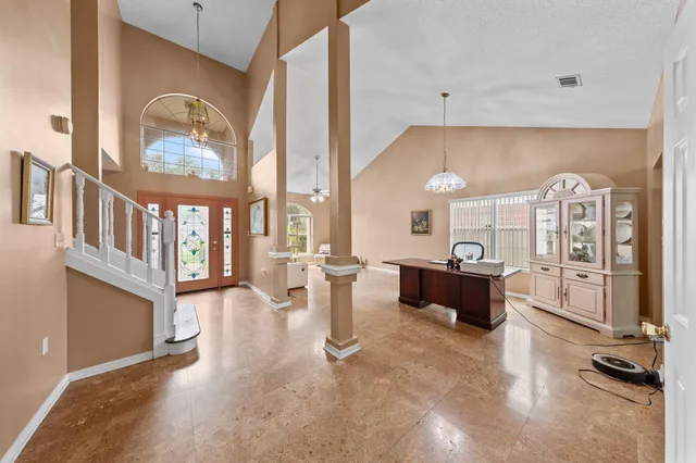 a view of living room with furniture and a large window