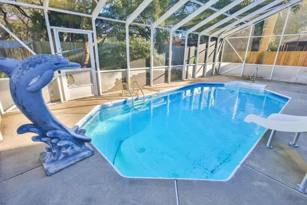 a view of a swimming pool with a patio