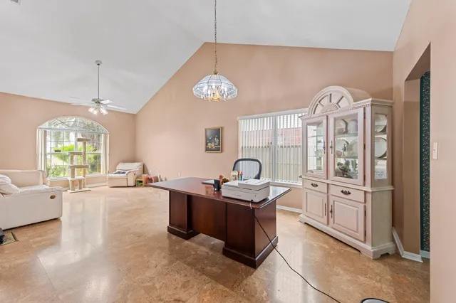 a view of a kitchen center island dining table and chairs