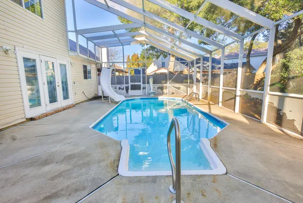 a view of a swimming pool with a lounge chair