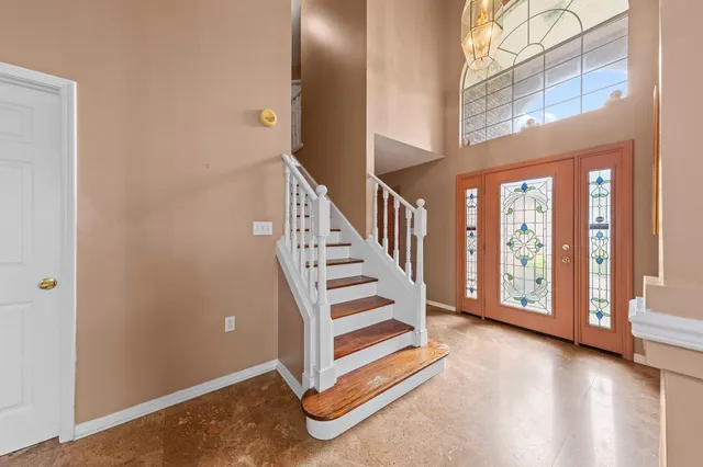 a view of a hallway with staircase