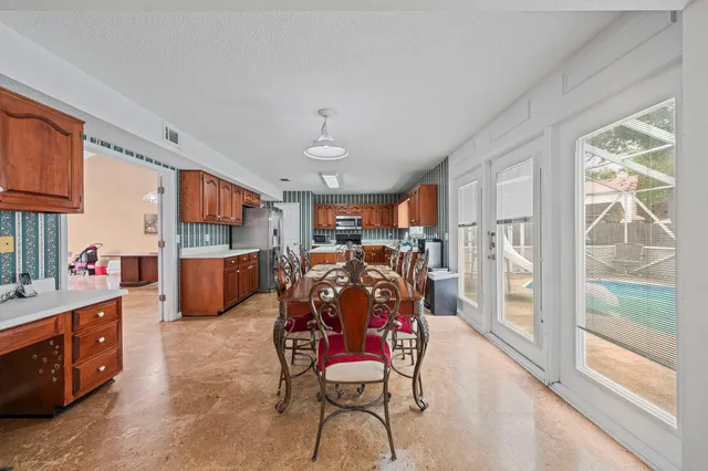 a very nice looking room with a large window and furniture