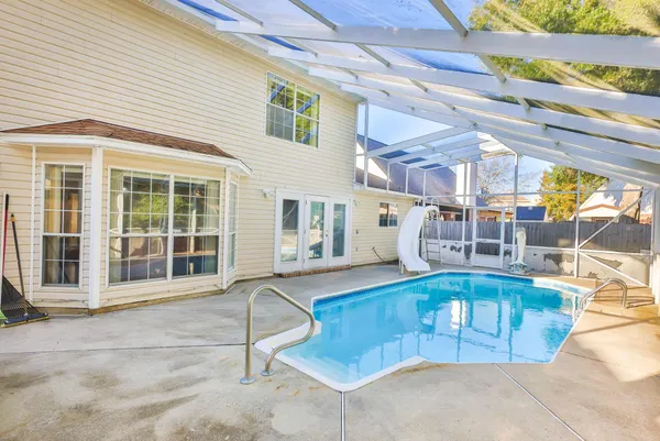 a view of a swimming pool with a patio
