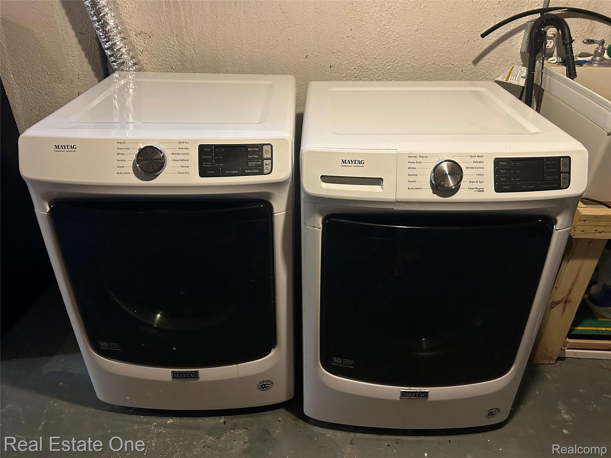 2659 Benstein Road Commerce Township, MI 48382 - Photo 21 of 26 White Maytag washer and dryer set with black front-loading doors and digital controls
