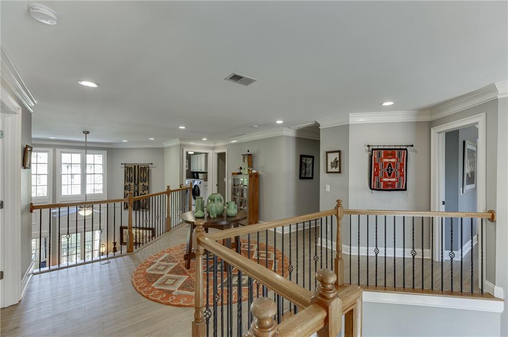 2758 Pathview Drive Dacula, GA 30019 - Photo 22 of 48 a view of a hallway with wooden floor and windows