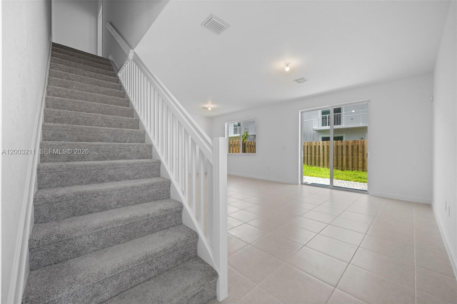 715 Southeast 15th Street Homestead, FL 33034 - Photo 15 of 38 a view of entryway and hall with a window