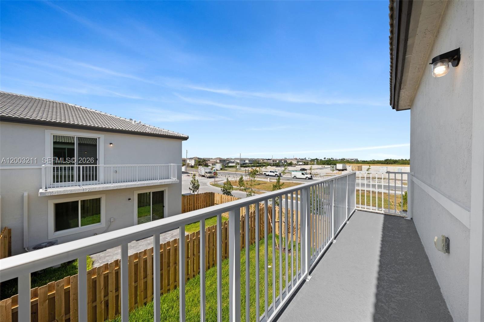 715 Southeast 15th Street Homestead, FL 33034 - Photo 20 of 38 a balcony with view of city skyline