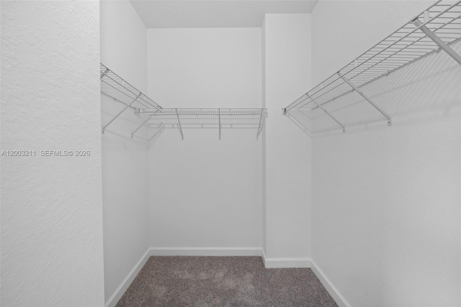 715 Southeast 15th Street Homestead, FL 33034 - Photo 24 of 38 a view of a room with racks on the wall