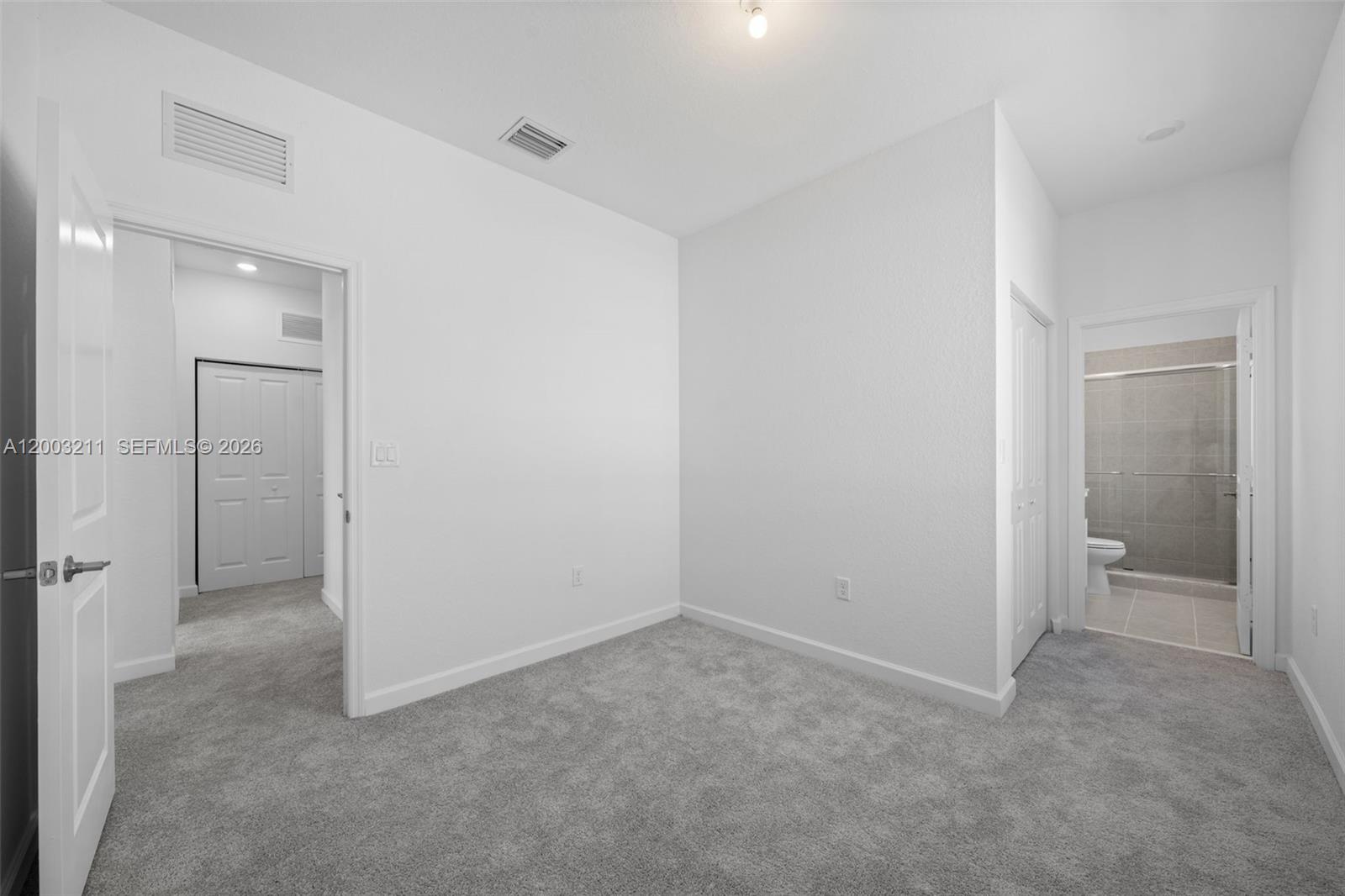 715 Southeast 15th Street Homestead, FL 33034 - Photo 28 of 38 wooden floor and closet in a room
