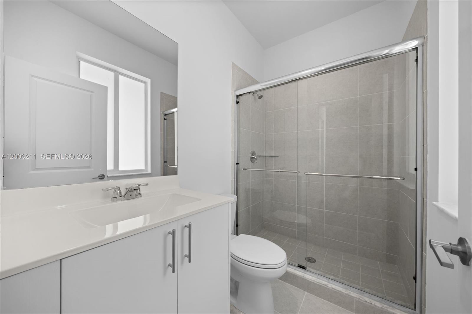 715 Southeast 15th Street Homestead, FL 33034 - Photo 29 of 38 a bathroom with a sink toilet and shower