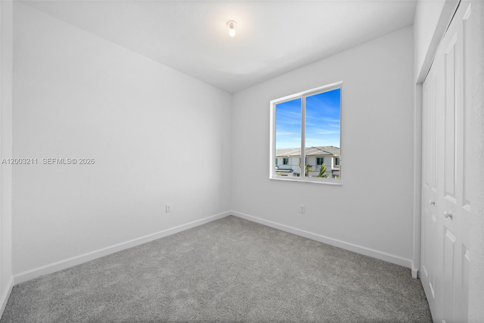 715 Southeast 15th Street Homestead, FL 33034 - Photo 30 of 38 an empty room with a window