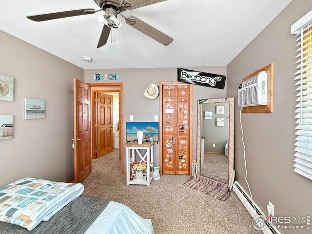 a bedroom with furniture and a chandelier