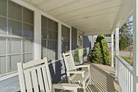 a view of balcony with furniture