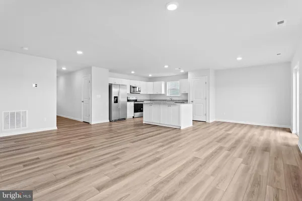 a view of kitchen with wooden floor