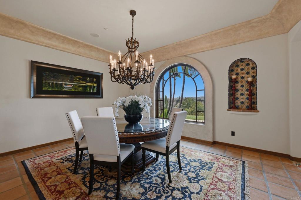 3244 Olivenhain Farms Road Encinitas, CA 92024 - Photo 11 of 47 a view of a dining room with furniture and chandelier
