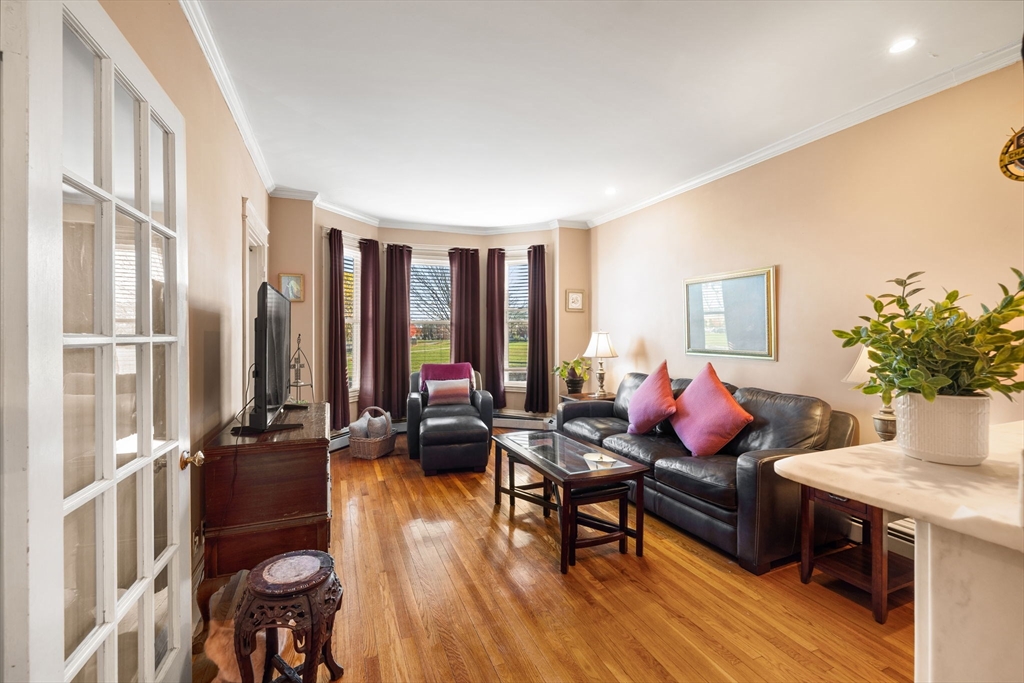 37 M Street Boston, MA 02127 - Photo 17 of 42 a living room with furniture and floor to ceiling windows