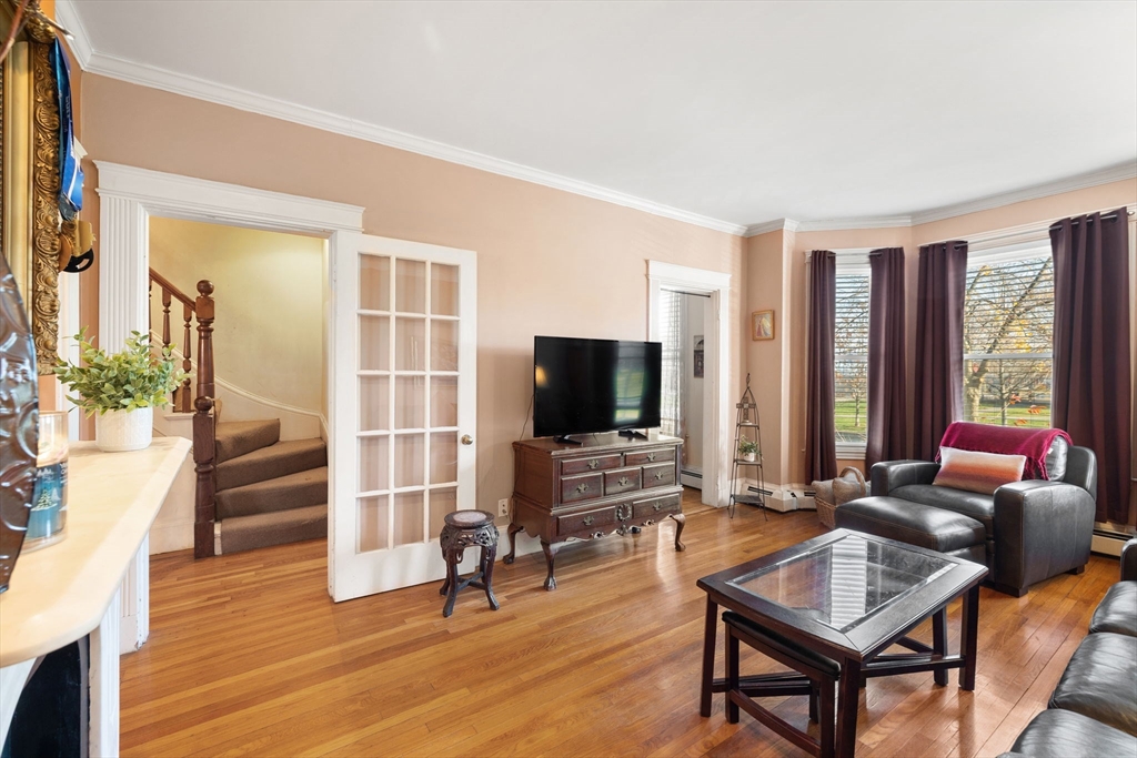 37 M Street Boston, MA 02127 - Photo 19 of 42 a living room with furniture and a flat screen tv