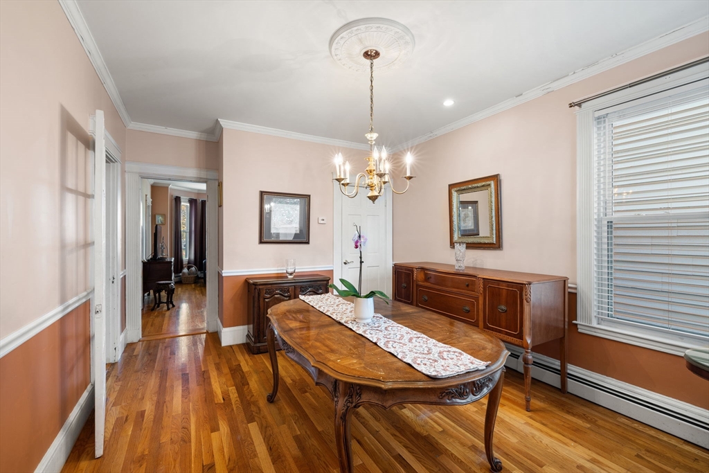 37 M Street Boston, MA 02127 - Photo 24 of 42 a living room with dining table furniture and a chandelier