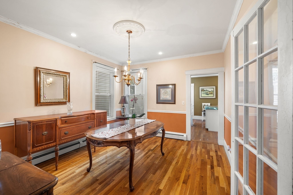 37 M Street Boston, MA 02127 - Photo 25 of 42 a living room with fireplace furniture and a wooden floor