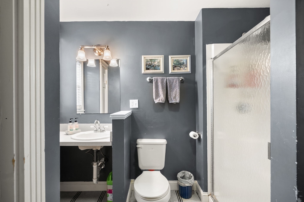 37 M Street Boston, MA 02127 - Photo 28 of 42 a bathroom with a toilet sink and mirror